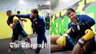 Chechen dictator Kadyrov filmed sparring against UFC fighter in bizarre video [upl. by Aciraa108]