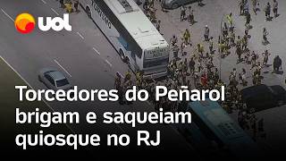 Torcedores do Peñarol brigam ateiam fogo em ônibus e saqueiam quiosque no Rio de Janeiro vídeo [upl. by Zabrine]