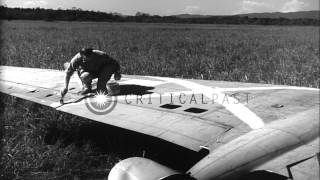 United State Whirlaway helicopter pilot checks a crashed B25 in United states HD Stock Footage [upl. by Ennayr937]