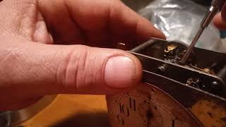 Adjusting a hair spring clock movement Do not use the plyers to do this Use screwdriver in notch [upl. by Somerset]