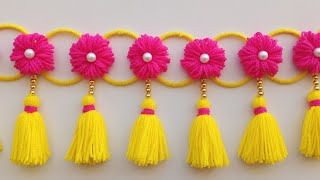 ऊन से बनाए नए डिजाइन की तोरणWoolen toran designWoolen flower door hangingWoolen craft ideaswool [upl. by Hajed]