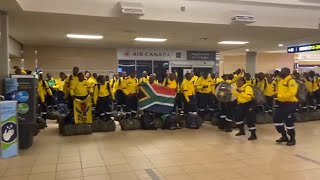 South African firefighters sing and dance after arriving at Edmontons airport [upl. by Ecart]