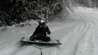 Sledding behind King Quad on old truck hood [upl. by Nayrda248]