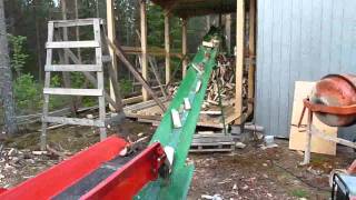 Splitting firewood straight into a shed Part 2 [upl. by Moia]