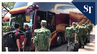 Recruits board buses taking them to SAF Ferry Terminal from Selarang Camp [upl. by Anuahc]