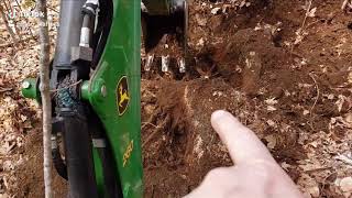 More stump removal John Deere 1023E TLB with 260 backhoe [upl. by Prakash]