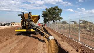 Stone slinger backfills Solar Farm cable trench by Metropolis Services Australia [upl. by Teahan]