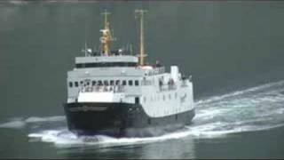 QE2 passes ferry in Geiranger Fjord [upl. by Yelkcub174]