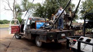 Raising the poles on a small winch truck [upl. by Yablon]