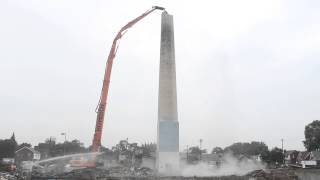 Smoke Stack Demolition with HighReach Excavator  HOMRICH Demolition [upl. by Llezniuq]