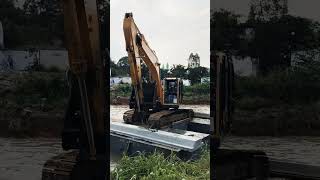 Preparation for handling Corrugated Concrete Sheet Piles using a pontoon excavator shorts [upl. by Ardnuassac]