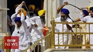 Sikh groups clash with swords at Indias Golden Temple  BBC News [upl. by Scherman]