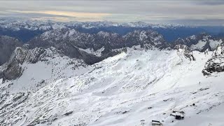 Zugspitze in the Alps going up the highest mountain in Germany [upl. by Yelkcub216]