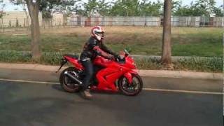 Sound of Kawasaki Ninja 250R 2009 stock exhaust  muffler with a little wheelie [upl. by Raffin]