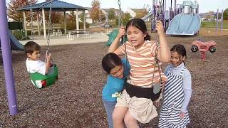 Kid Gets Stuck on a toddler Swing Set FUNNY  美国小姑娘被困在蹒跚学步的秋千上 [upl. by Annol]