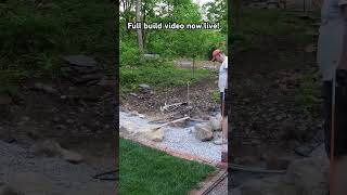 Laying the first course of my latest mortared stone wall landscaping [upl. by Tavish]