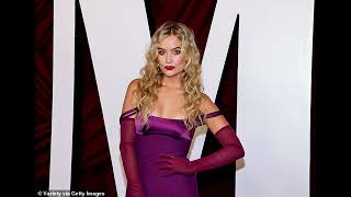 Laura Whitmore poses up a storm in a purple cutout gown as she attends the Glamour Women Of The Yea [upl. by Idnor]