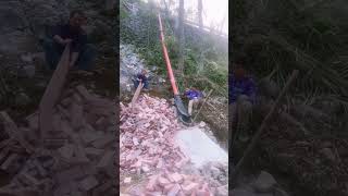 The process of unloading bricks down the hillside [upl. by Assenar]