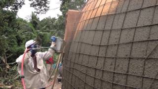 Monolithic Dome Construction with a Stucco Sprayer  Hildebrand Construction in Haiti [upl. by Nelg]