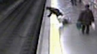 Fainting woman falls on train tracks [upl. by Atiragram444]