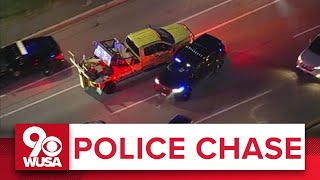 POLICE CHASE COVERAGE Stolen tow truck plows through police and civilian cars in Maryland [upl. by Hillard]