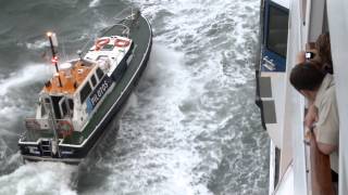 Lisbon pilot disembarking from Adonia in rough seas [upl. by Hannaj]