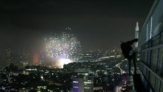 Student Climbs Skycraper For New Years Eve Fireworks [upl. by Ahsieki568]