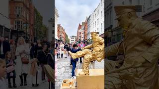 Taking a seat to entertain my little fans with the Goldmanlivingstatue londongoldmanstatue [upl. by Oinolopa578]