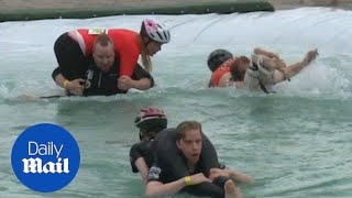 Lithuanian couple win world wifecarrying competition [upl. by Ahsinyar]