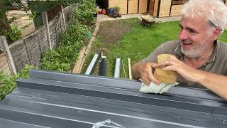 installing insulated roof panel part two [upl. by Moclam]