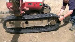 Takeuchi TB016 Fitting New Rubber Tracks HD [upl. by Macintyre]