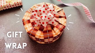 Easy Round Gift Packing  How to Wrap a Round Box  Christmas Gift Wrap giftwrap [upl. by Enortna230]