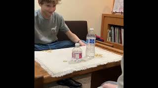 3 bottle flips and the tablecloth trick at the same time [upl. by Aihset]