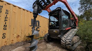 Augering Holes and Setting Poles With Kubota SVL753 Skid Steer [upl. by Burrow]