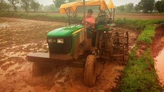 John Deere 5055e  puddling with double cage wheel  5310 [upl. by Ihcalam301]