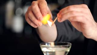 How to Flame an Orange Peel  DrinkSkool Bar Techniques [upl. by Bannon]