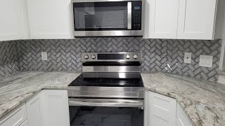 Herringbone Glass Tile Backsplash Installation [upl. by Rape136]