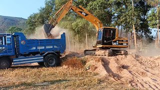 AX brand CAT 312B is digging a field at the foot of a mountain in a new place [upl. by Noicpecnoc]