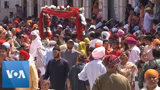 Sikhs in Pakistan Celebrate Vaisakhi Festival  VOANews [upl. by Agripina578]