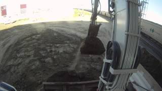 Takeuchi TB180 top of cab view loading a tandem truck [upl. by Tab]