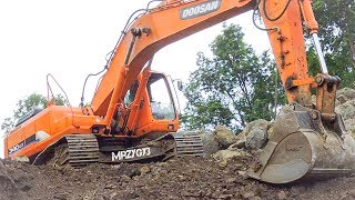 Large Digger Excavator Doosan Digging Loading Dirt Into Dump Truck [upl. by Larianna]