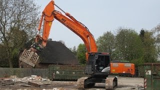 Follow this skilled operator in his Hitachi Zaxis 350 crawler excavator tearing down a car workshop [upl. by Adnerad]