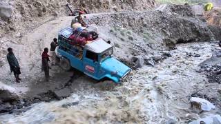 Jeep crossing creek that washed out roadPakistani Glacial Crossing [upl. by Adnilram253]