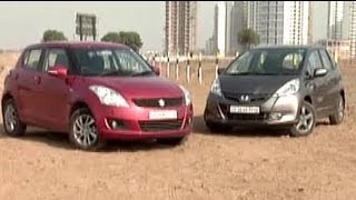 Swift vs Jazz Which is Indias hottest hatchback [upl. by Ellatsyrc777]