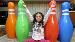 Playing with Giant Inflatable Bowling Pins for children HZHtube Kids Fun [upl. by Stoll120]