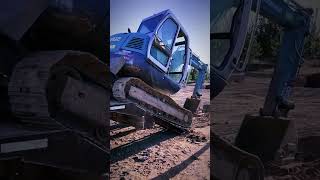 How Does an Excavator Get Onto a Truck [upl. by Neerihs]