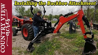 Getting the tractor ready to dig some trench Mounting the Backhoe attachment on the TYM 2515 [upl. by Dduj]