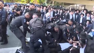 UltraOrthodox Jews block highway over Israeli Supreme Court decision on military service [upl. by Ahsema]