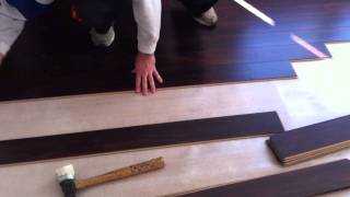 How to install a SwiftLock laminate flooring [upl. by Omolhs]