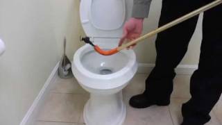 How to Unclog Toilet with Closet Auger  Plumbing Repairs [upl. by Yenitirb]